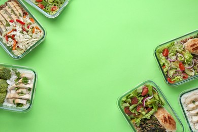 Photo of Healthy food. Different meals in glass containers on green background, flat lay. Space for text