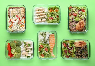 Photo of Healthy food. Different meals in glass containers on green background, flat lay