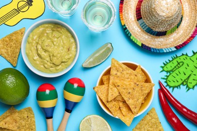 Photo of Flat lay composition with Mexican sombrero hat on light blue background