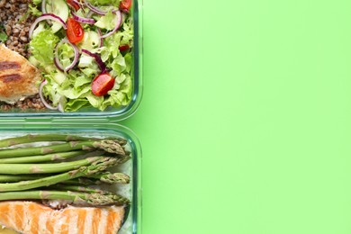 Photo of Healthy food. Different meals in glass containers on green background, top view. Space for text