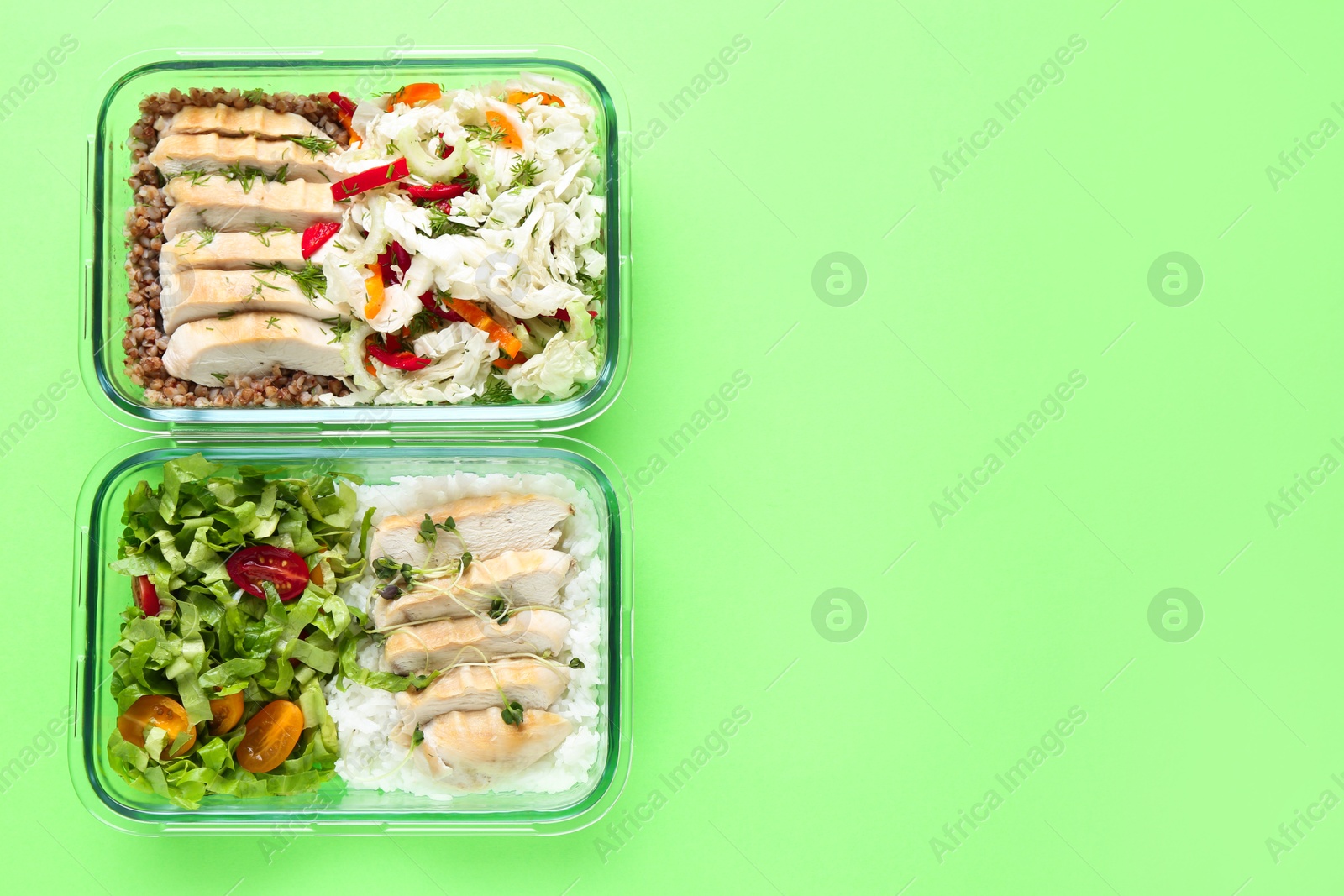 Photo of Healthy food. Different meals in glass containers on green background, top view. Space for text