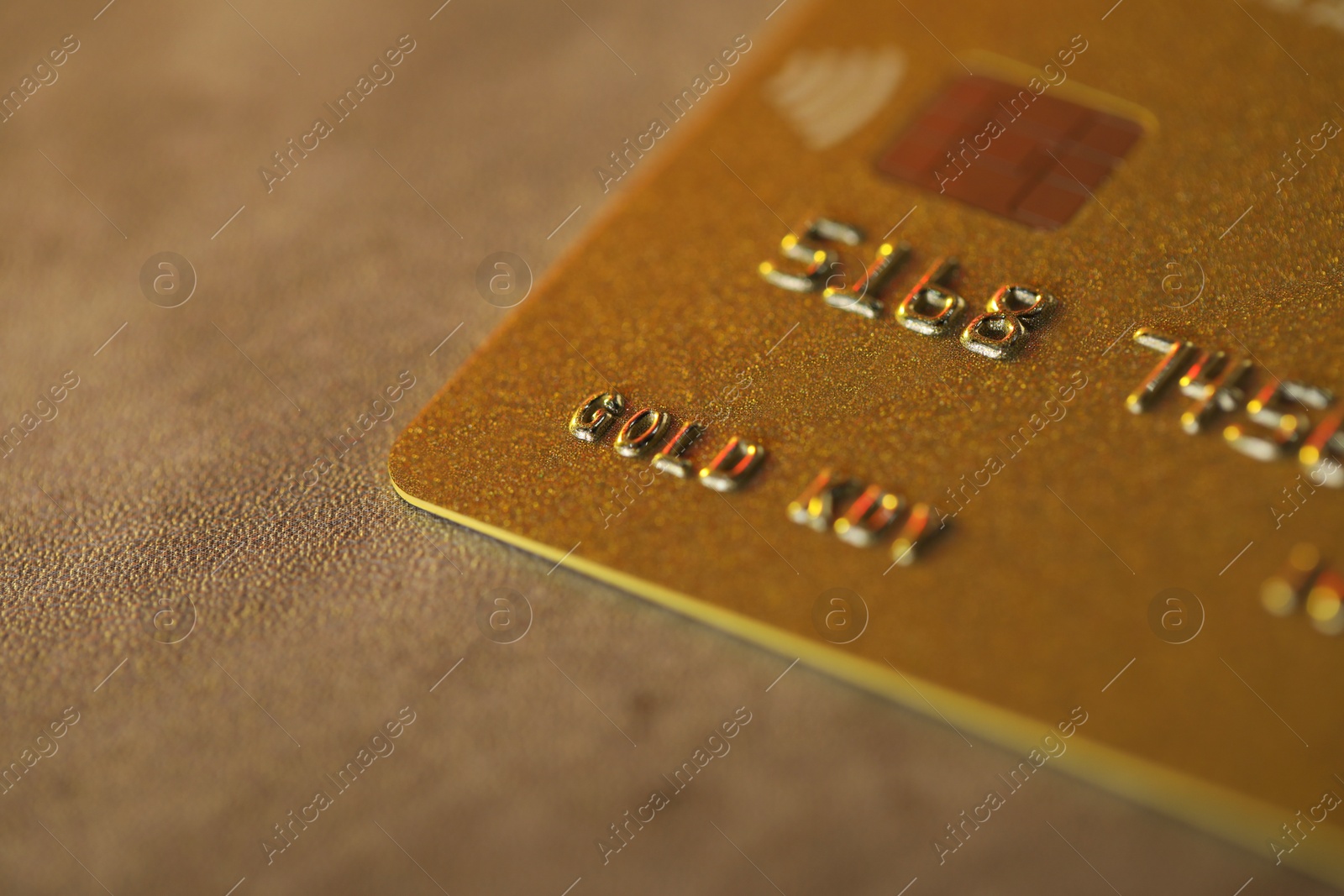 Photo of Plastic credit card on table, macro view. Space for text