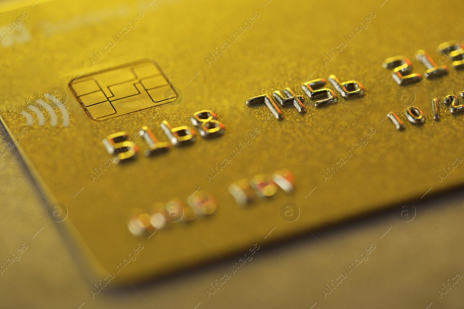 Photo of Plastic credit card on table, macro view