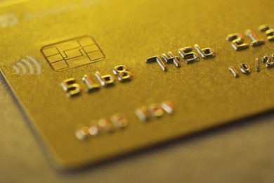 Photo of Plastic credit card on table, macro view