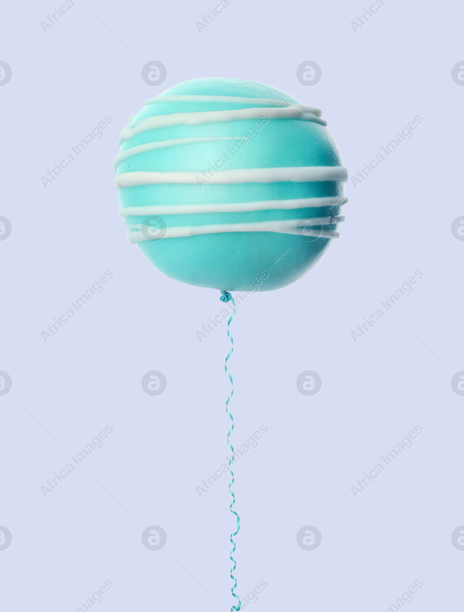 Image of Sweet cake pop with string like air balloon on grey background, creative collage