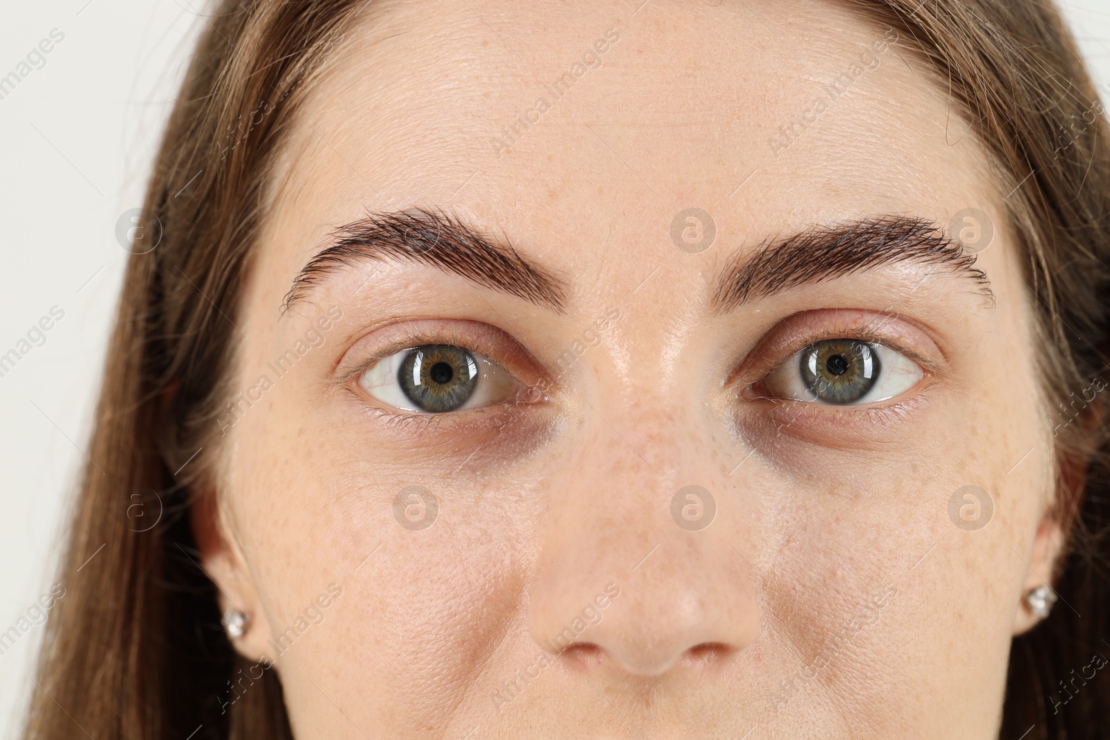 Photo of Closeup view of woman with beautiful eyes on white background