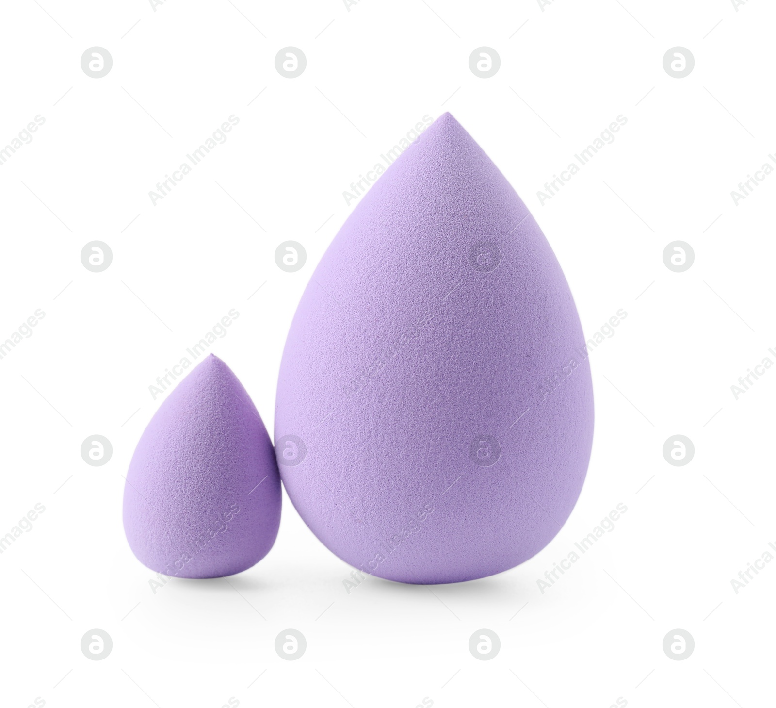 Photo of Two violet makeup sponges isolated on white