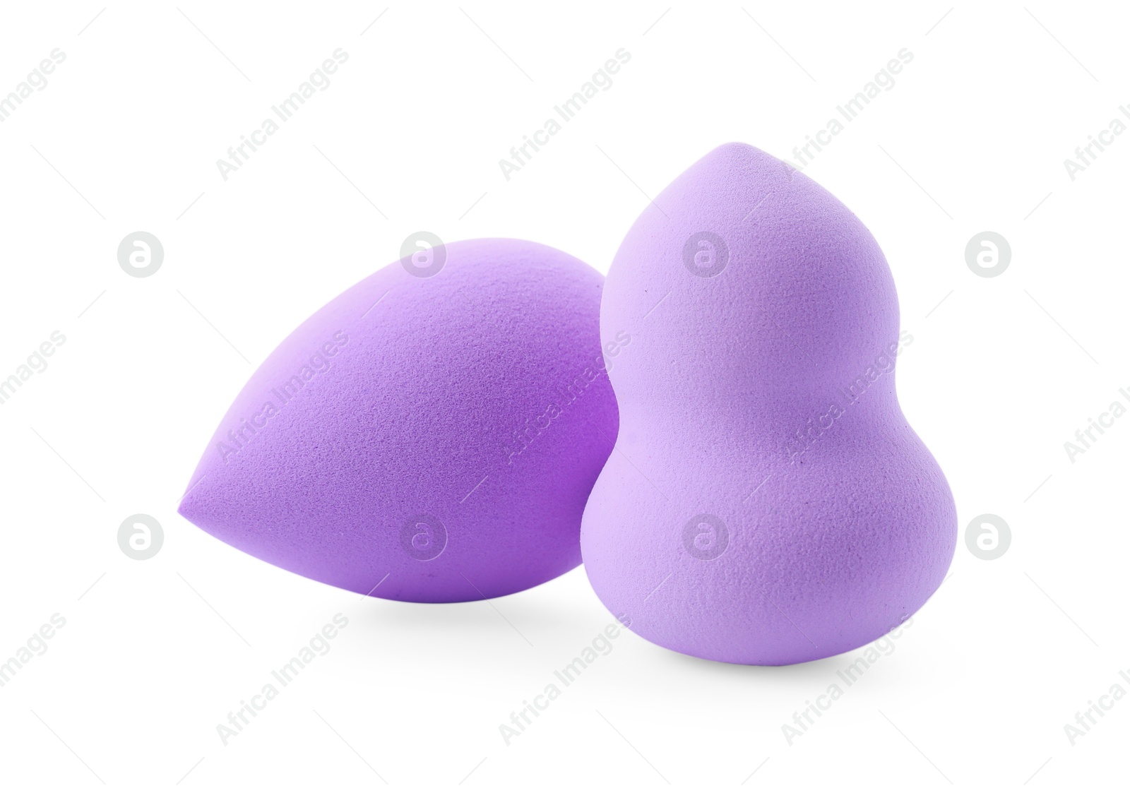 Photo of Two violet makeup sponges isolated on white