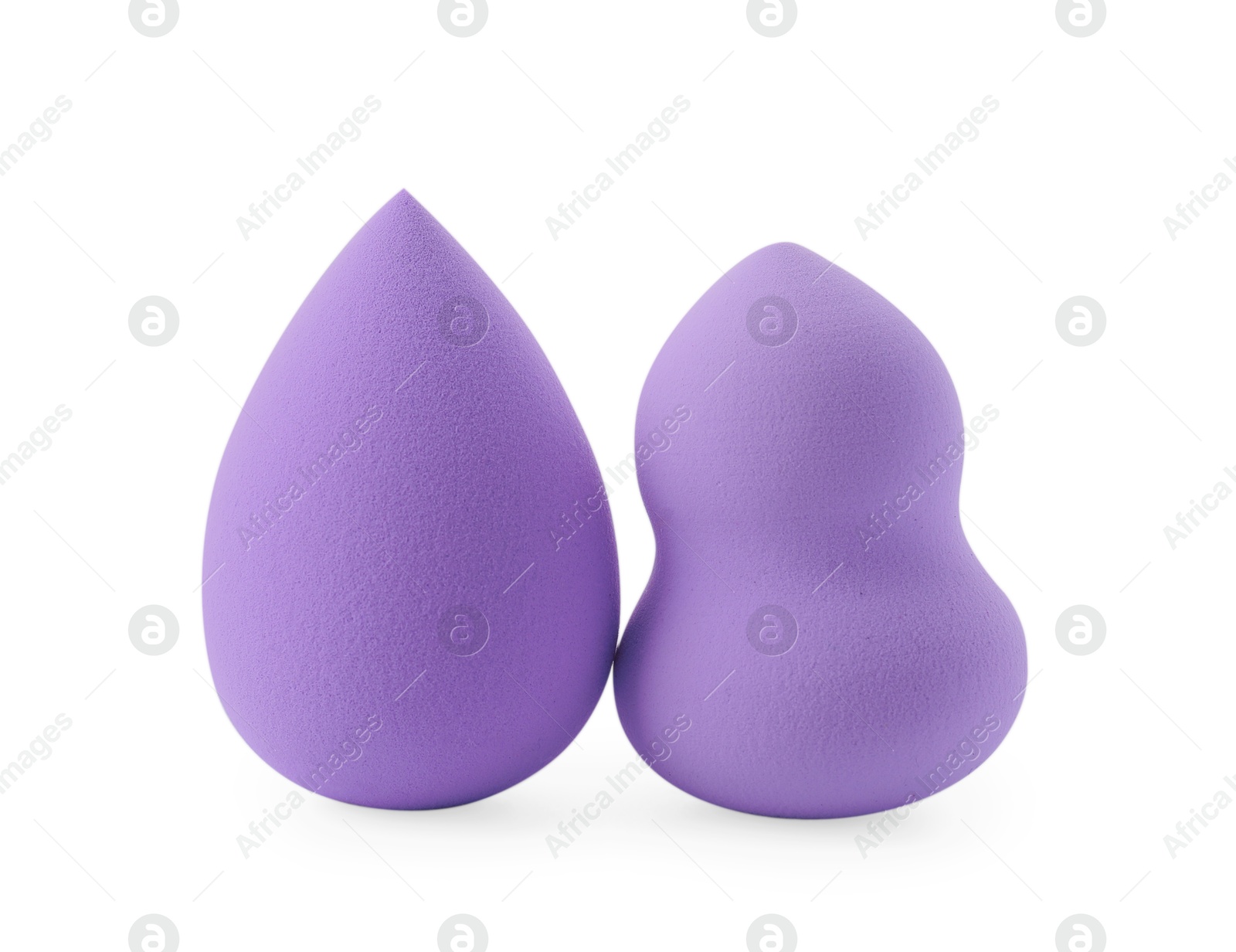 Photo of Two violet makeup sponges isolated on white