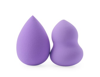 Two violet makeup sponges isolated on white