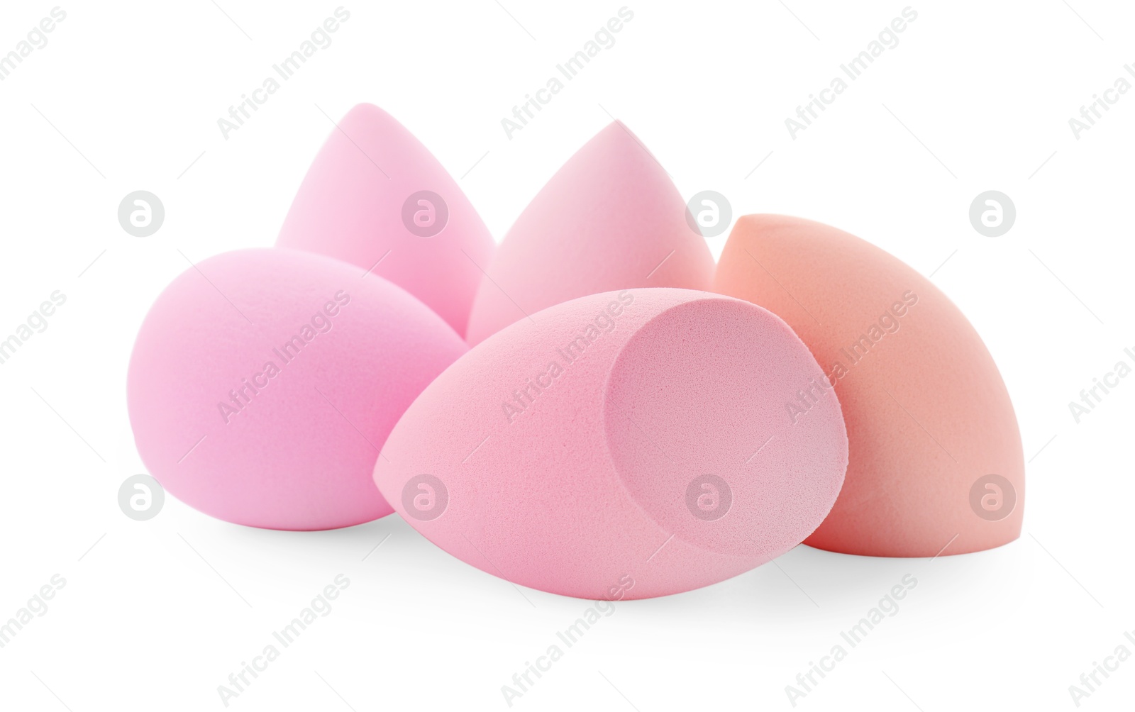 Photo of Pink and beige makeup sponges isolated on white