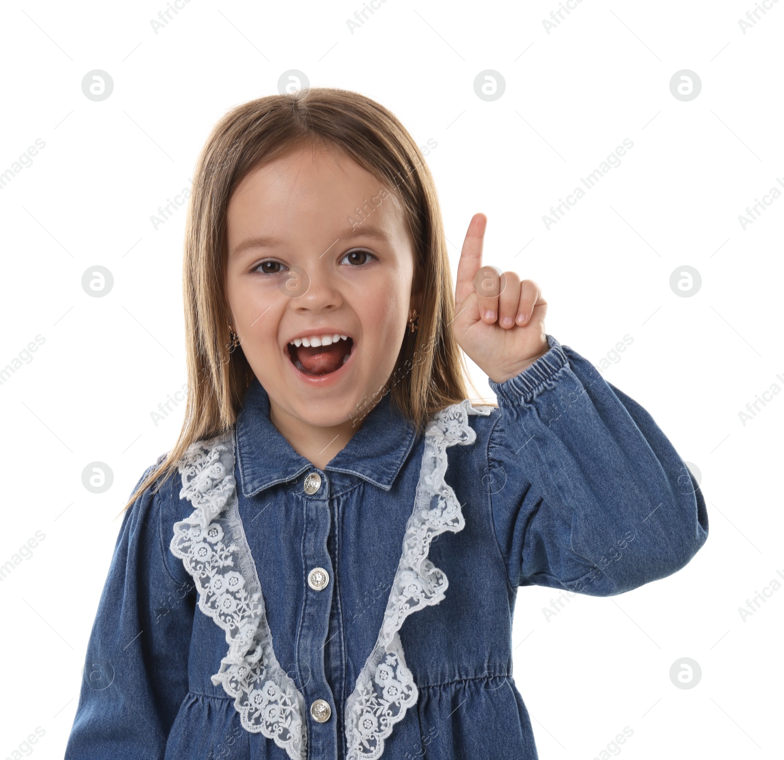 Photo of Portrait of emotional little girl pointing at something on white background
