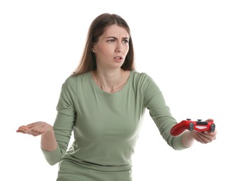 Unhappy woman playing video games with controller on white background