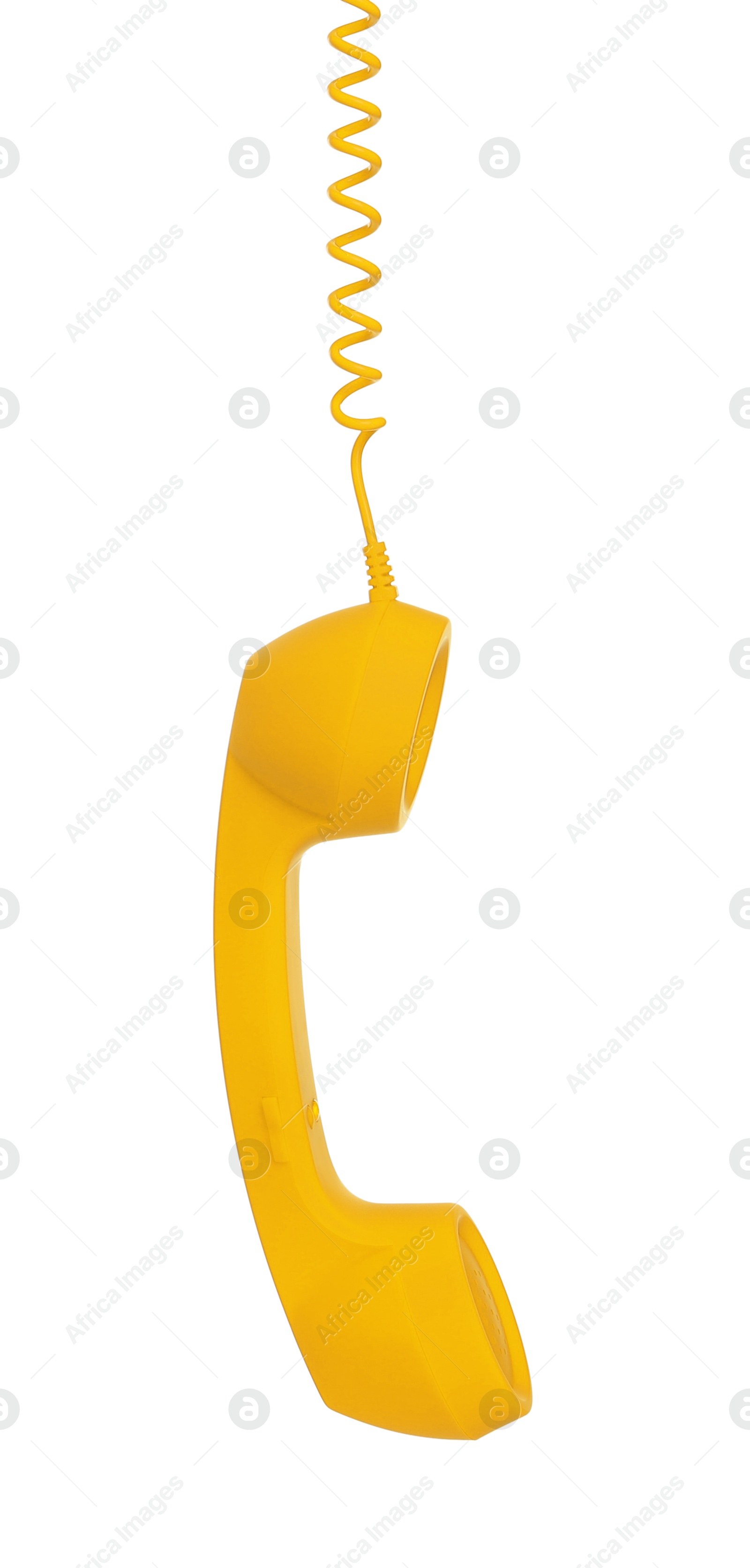 Image of Yellow telephone handset with cord isolated on white