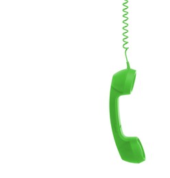 Green telephone handset with cord isolated on white