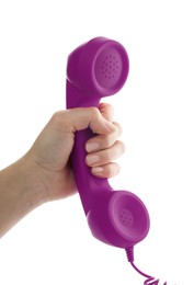 Image of Woman holding purple telephone handset on white background, closeup