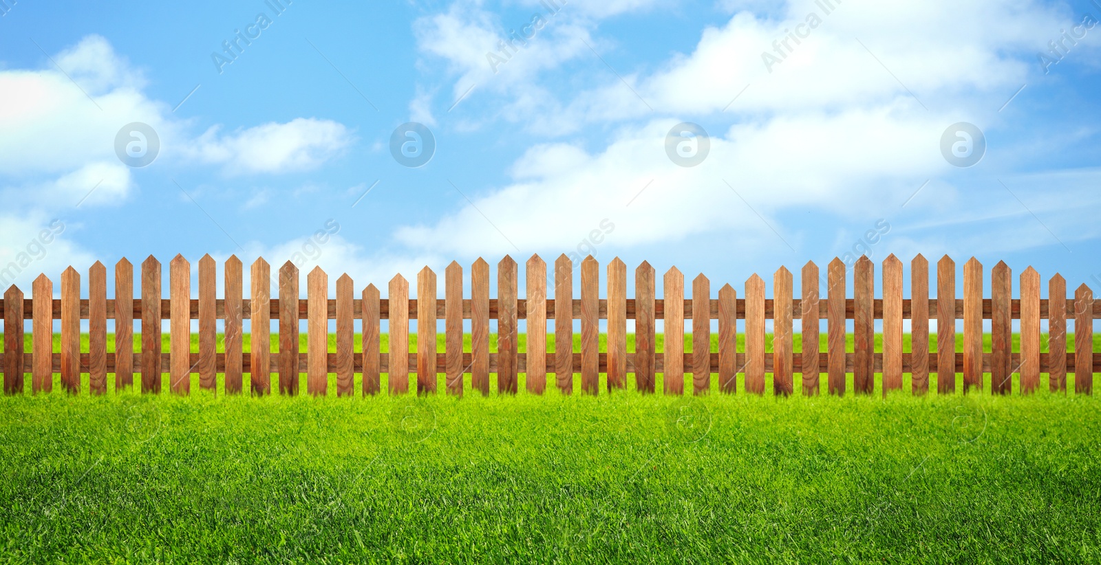 Image of Wooden fence and green grass outdoors, banner design