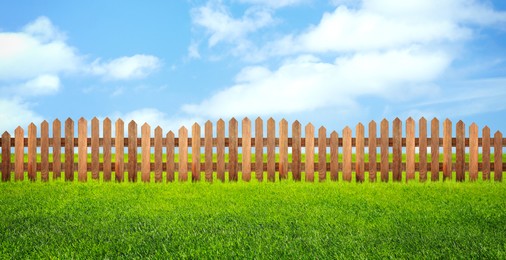 Wooden fence and green grass outdoors, banner design