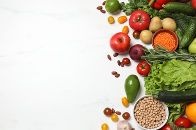 Source of protein for vegetarians. Different fresh vegetables, fruits and herbs on white marble table, space for text