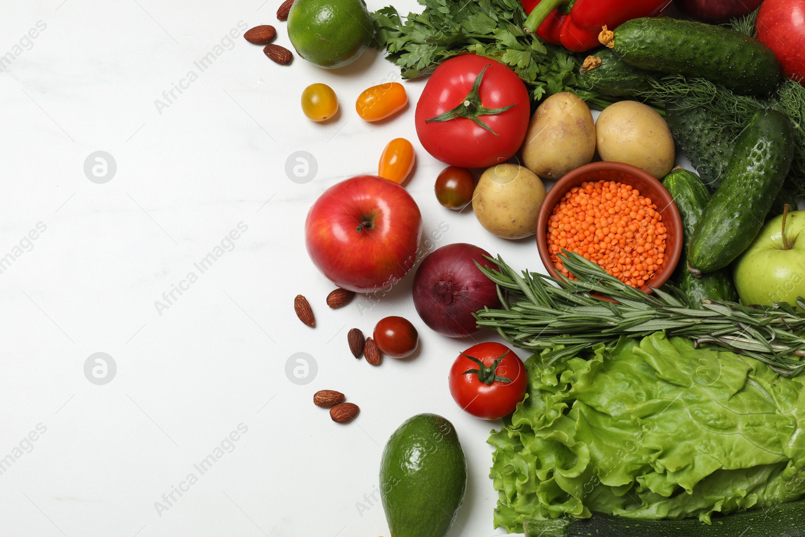 Photo of Source of protein for vegetarians. Different fresh vegetables, fruits and herbs on white marble table, space for text