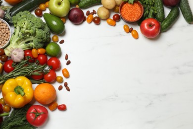 Photo of Source of protein for vegetarians. Different fresh vegetables, fruits and herbs on white marble table, space for text