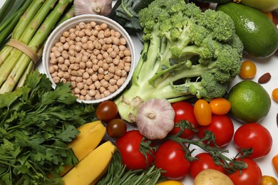 Source of protein for vegetarians. Different fresh vegetables, fruits and cereals as background, top view