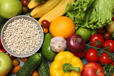 Photo of Source of protein for vegetarians. Different fresh vegetables, fruits and cereals as background, top view