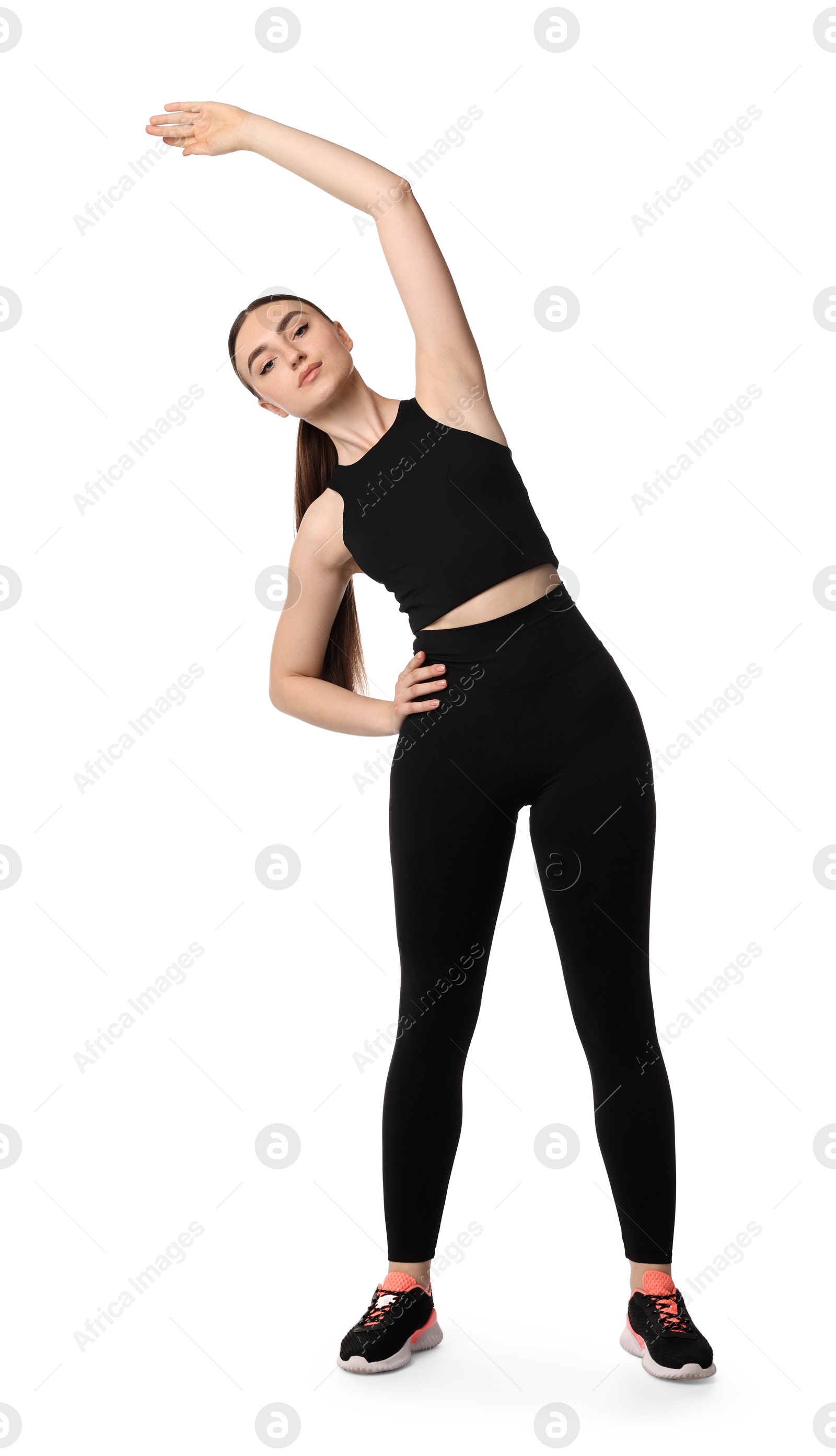 Photo of Aerobics. Young woman doing stretching exercise on white background