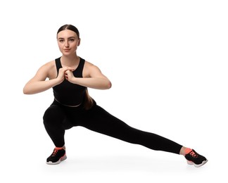 Photo of Aerobics. Young woman doing stretching exercise on white background