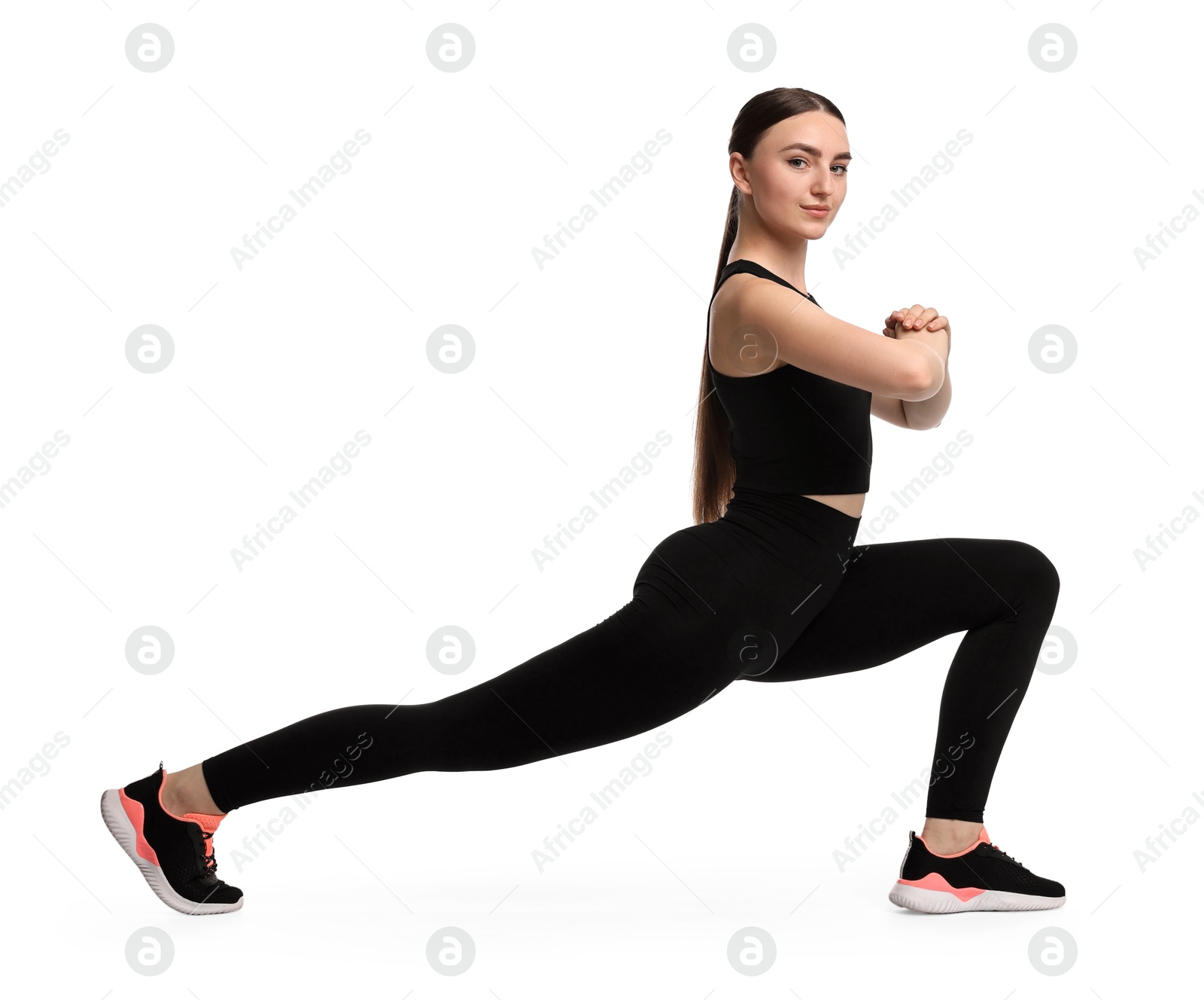 Photo of Aerobics. Young woman doing stretching exercise on white background