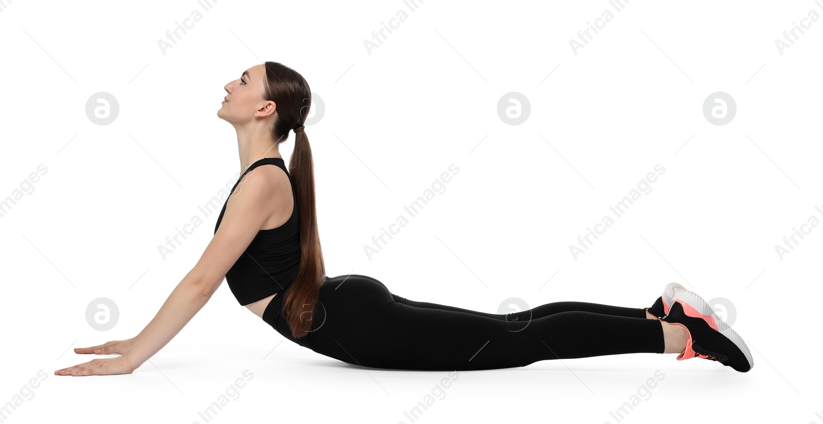 Photo of Aerobics. Young woman doing stretching exercise on white background