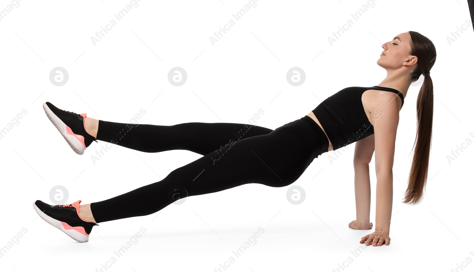 Photo of Young woman doing aerobic exercise on white background