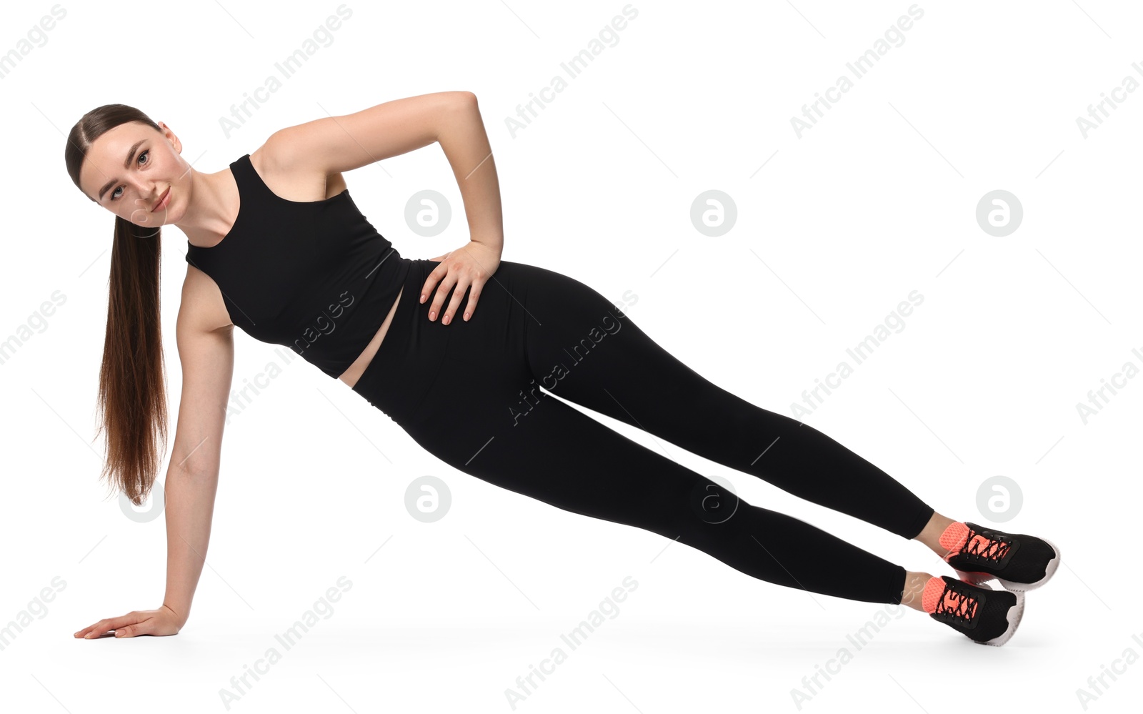 Photo of Young woman doing aerobic exercise on white background