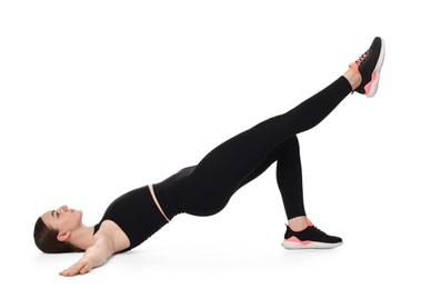 Young woman doing aerobic exercise on white background