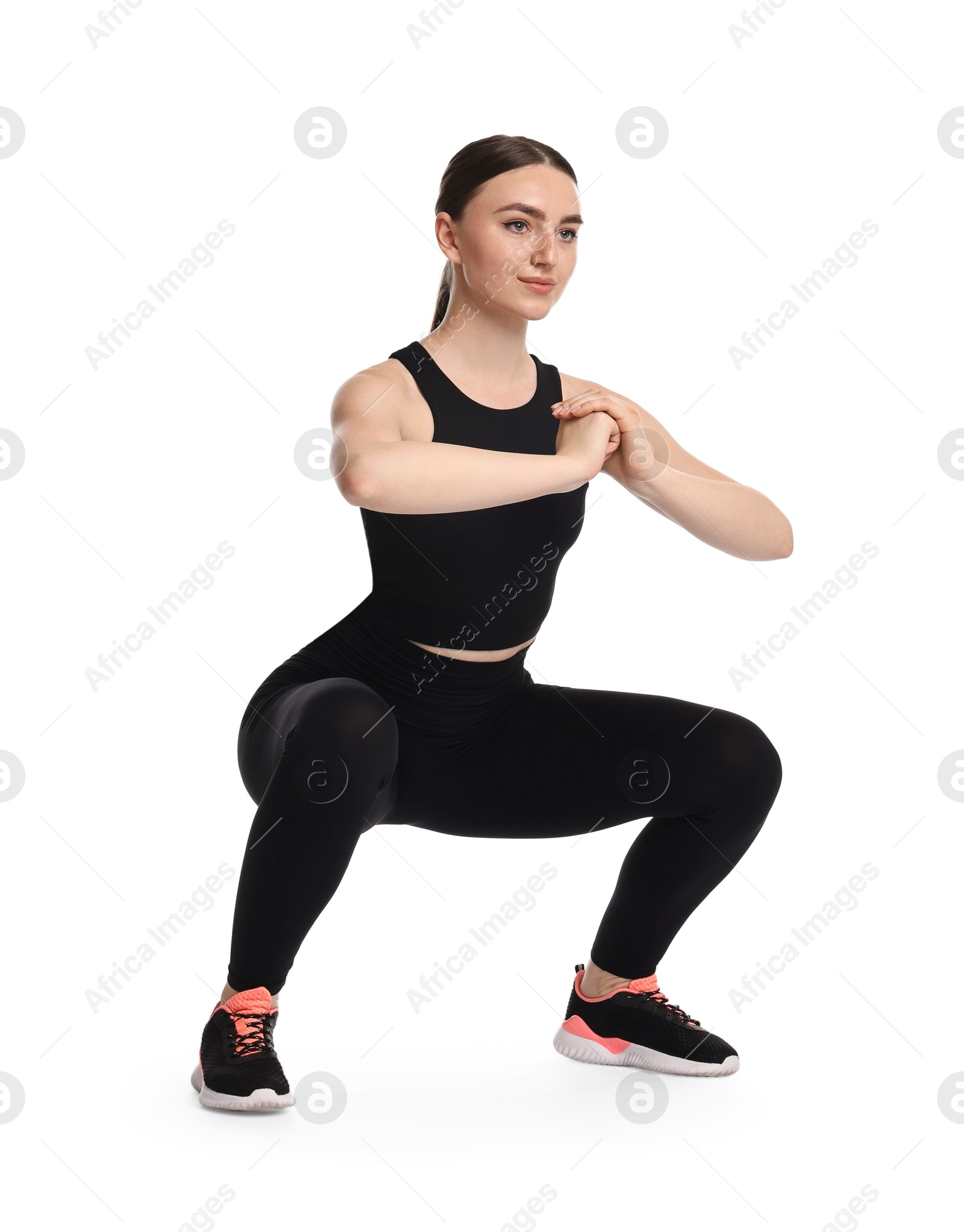 Photo of Young woman doing aerobic exercise on white background