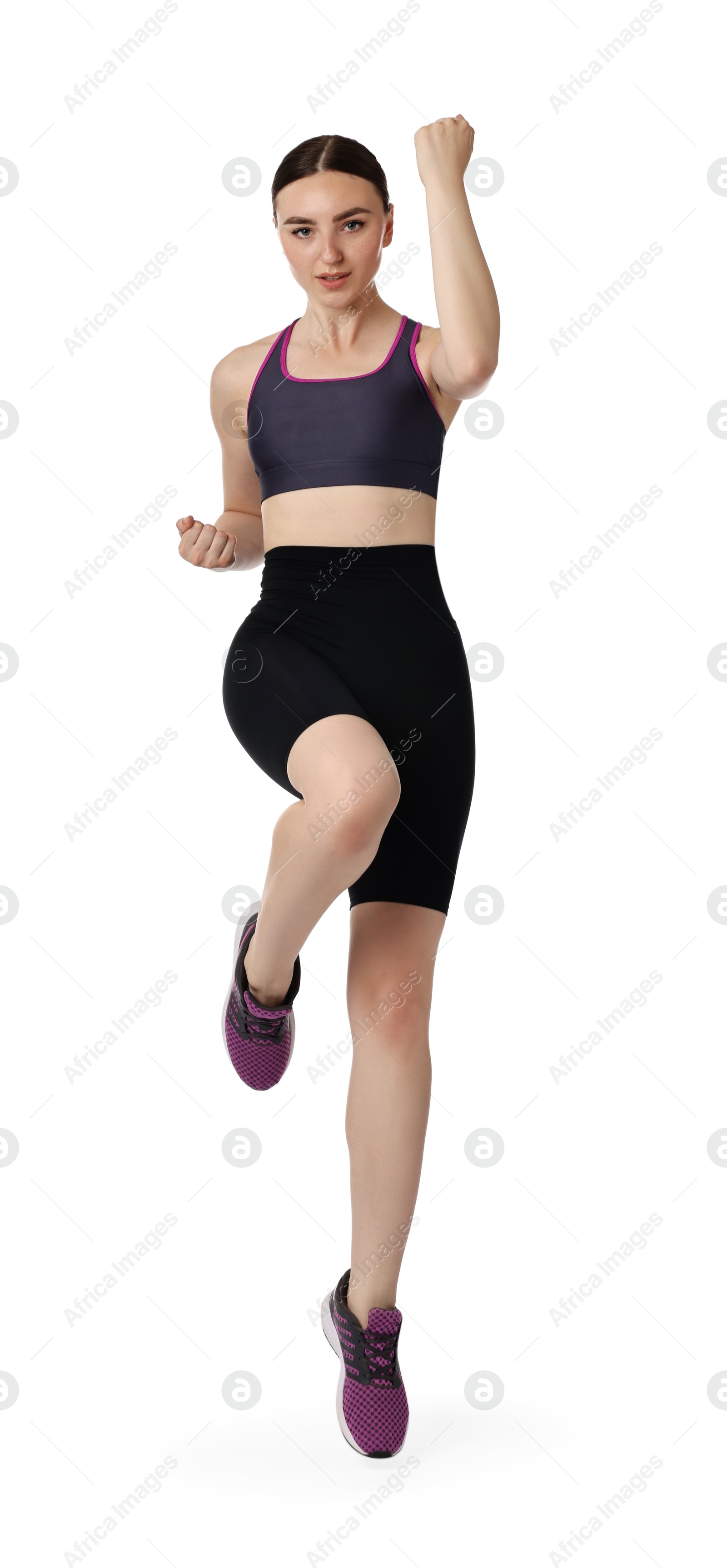 Photo of Young woman doing aerobic exercise on white background