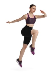 Young woman doing aerobic exercise on white background