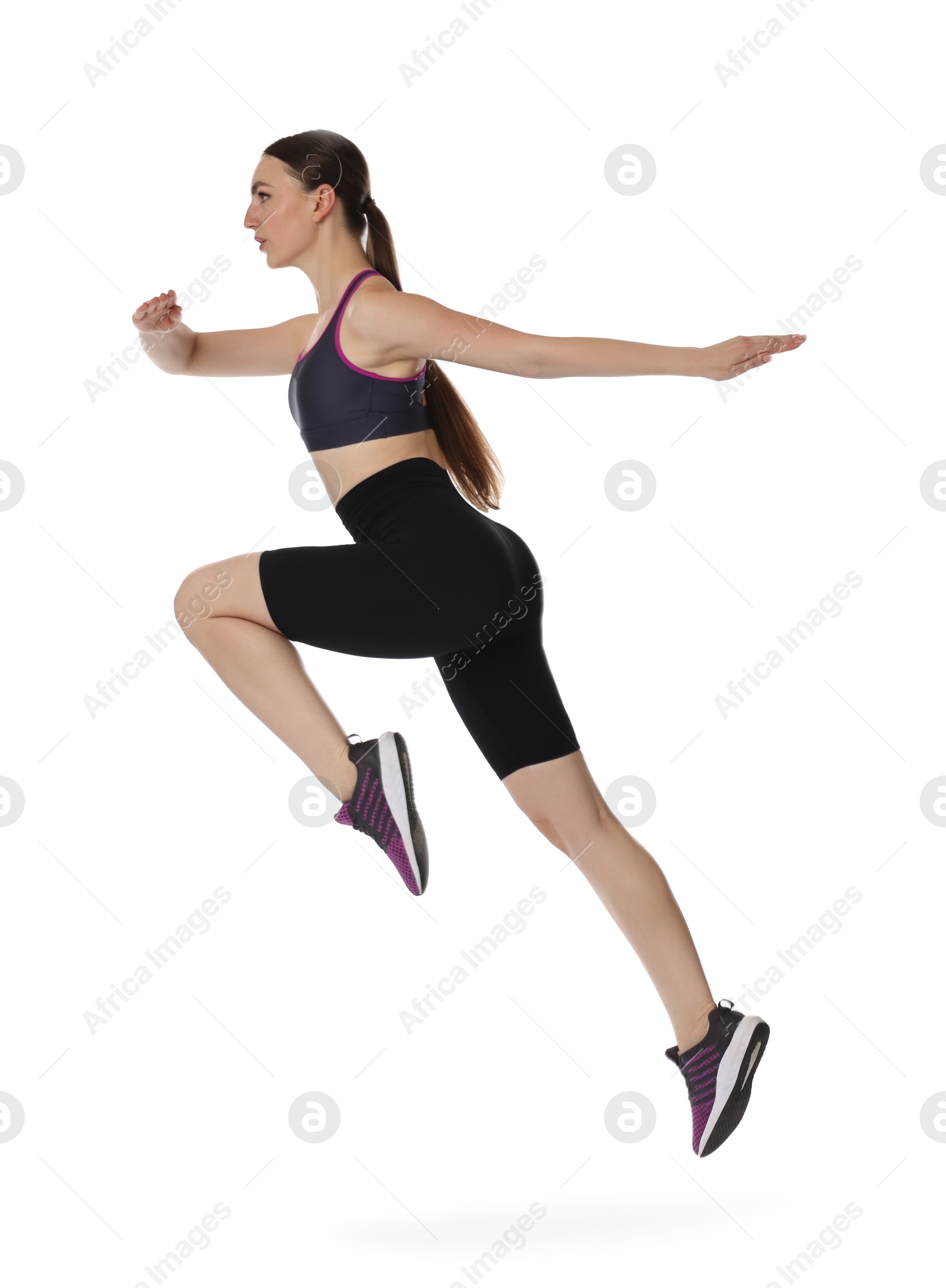 Photo of Young woman doing aerobic exercise on white background