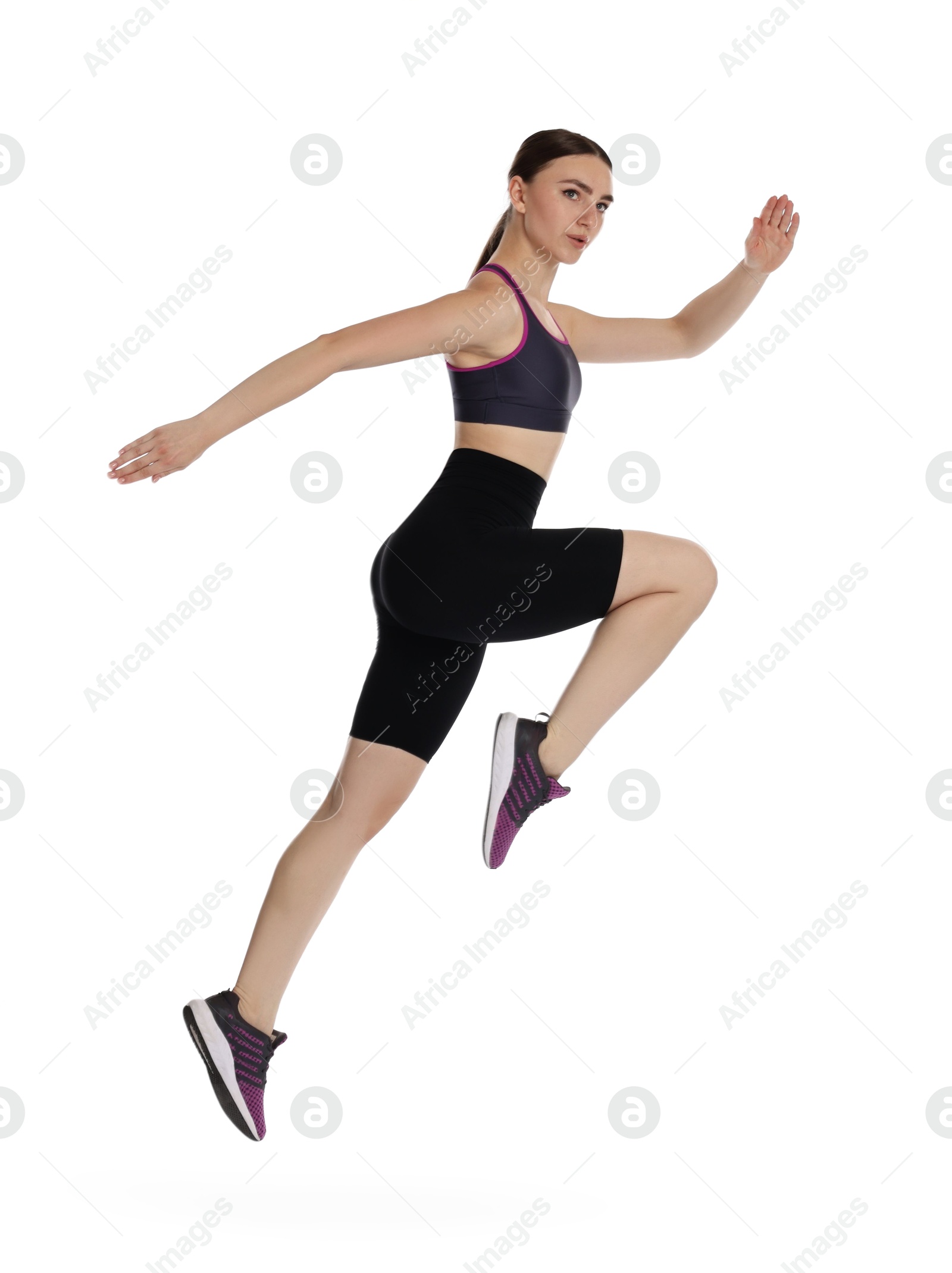 Photo of Young woman doing aerobic exercise on white background