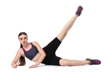 Photo of Young woman doing aerobic exercise on white background