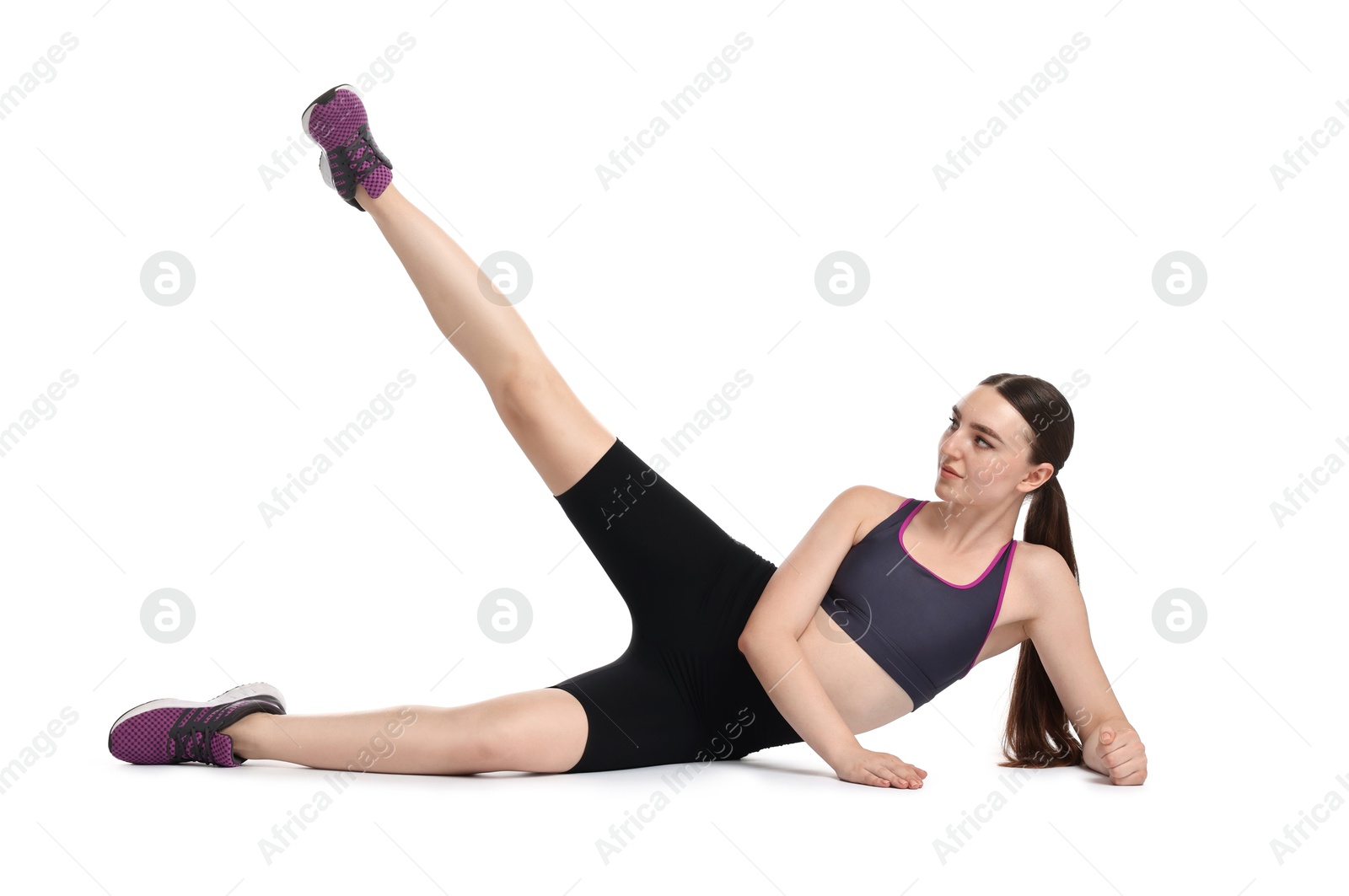 Photo of Young woman doing aerobic exercise on white background