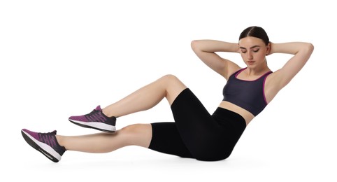 Young woman doing aerobic exercise on white background