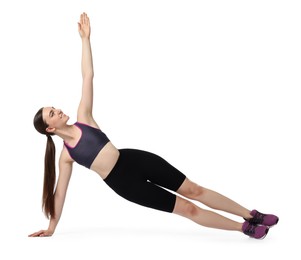 Young woman doing aerobic exercise on white background