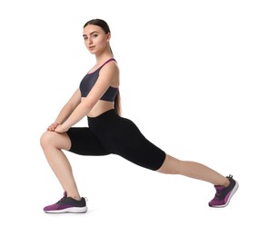Photo of Aerobics. Young woman doing stretching exercise on white background