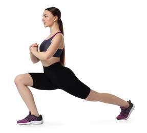 Photo of Aerobics. Young woman doing stretching exercise on white background