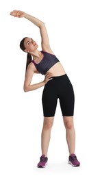 Aerobics. Young woman doing stretching exercise on white background