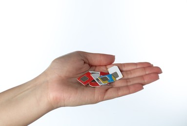 Woman with SIM cards on white background, closeup