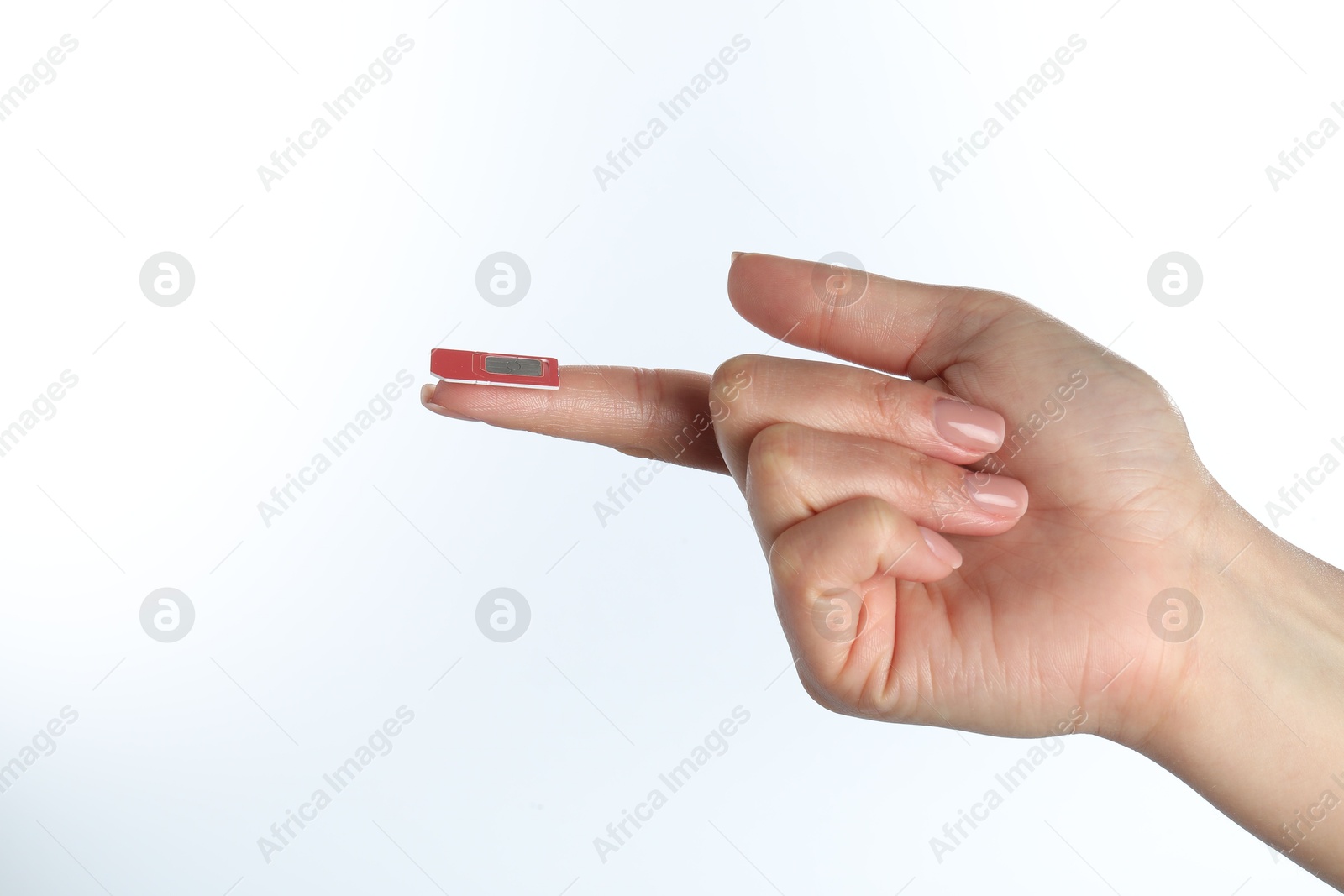 Photo of Woman with SIM card on white background, closeup