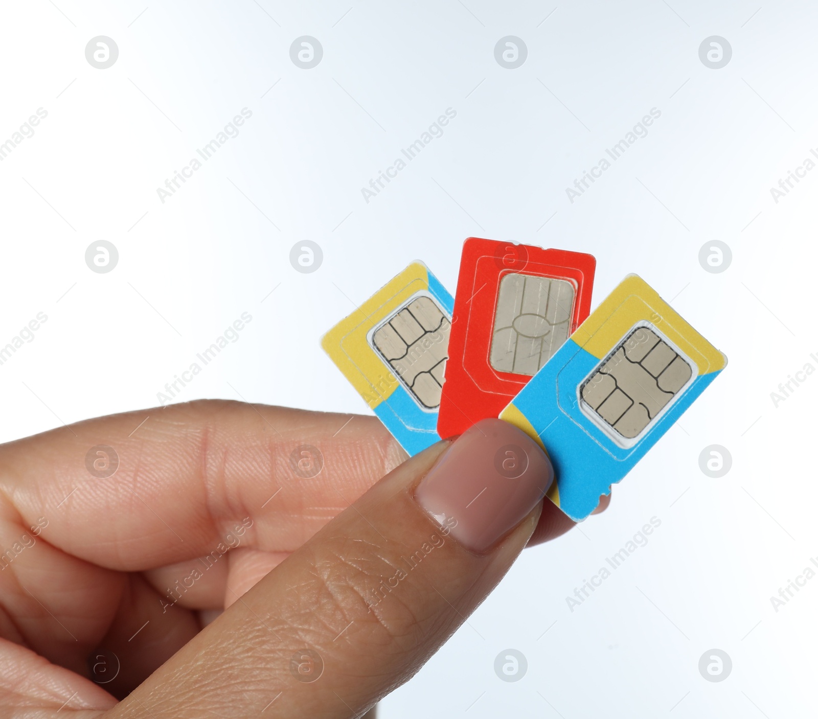 Photo of Woman with SIM cards on white background, closeup