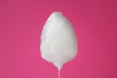Photo of One sweet cotton candy on pink background